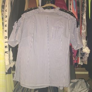 Blue and white stripped shirt.